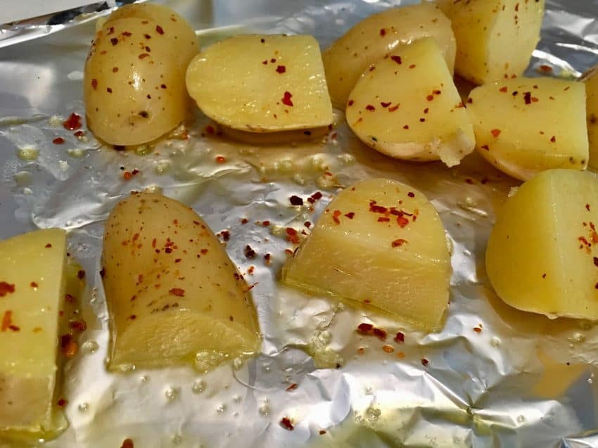 potatoes covered with olive oil and cayenne pepper