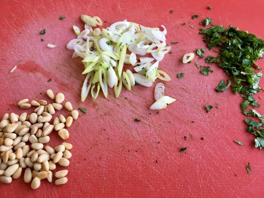 chopping board with chopped herbs