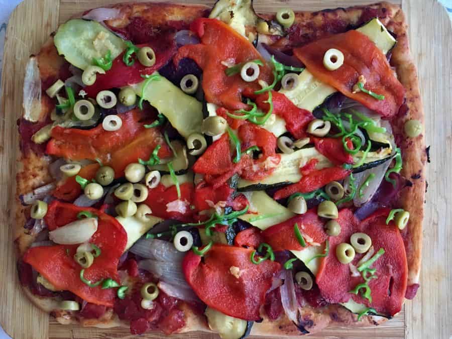 vegan pizza on chopping board