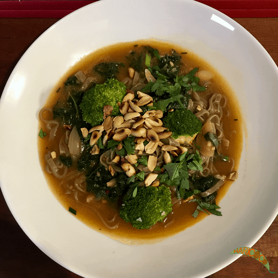noodle dish with green veggies and peanuts